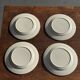 Set of 4 small dessert plates with a vintage stylised flower pattern.