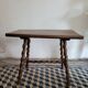 Brutalist coffee table with turned wooden legs