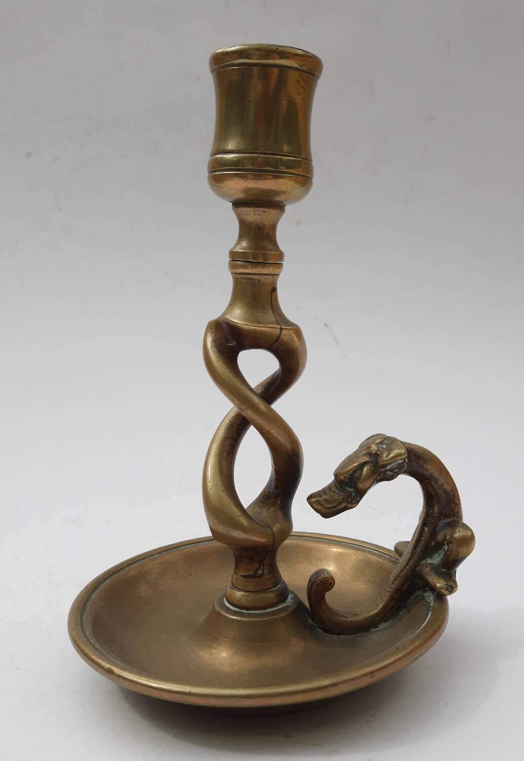 Antique bronze candlestick with dragon-shaped handle from the 17th century