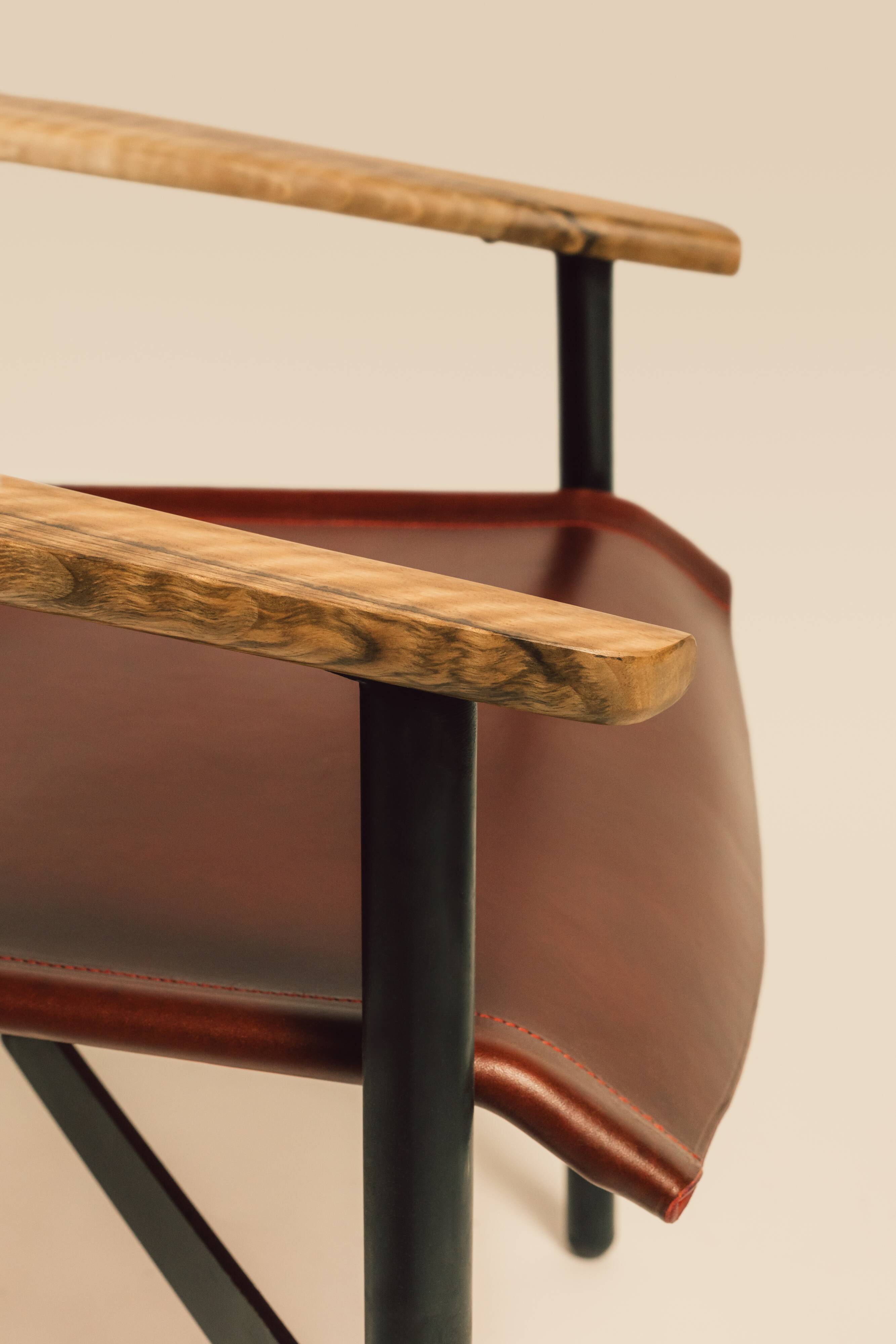 Maërl armchair, Galathée model, red leather, solid wood armrests of your choice