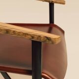 Maërl armchair, Galathée model, red leather, solid wood armrests of your choice