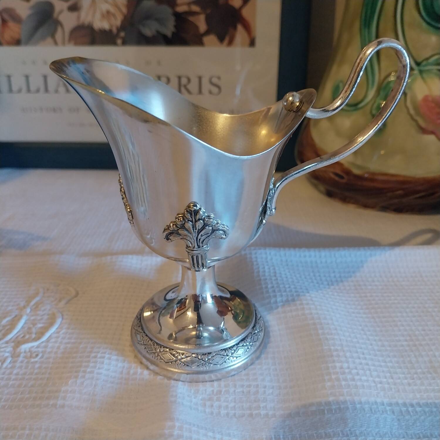 Old silver-plated milk jug