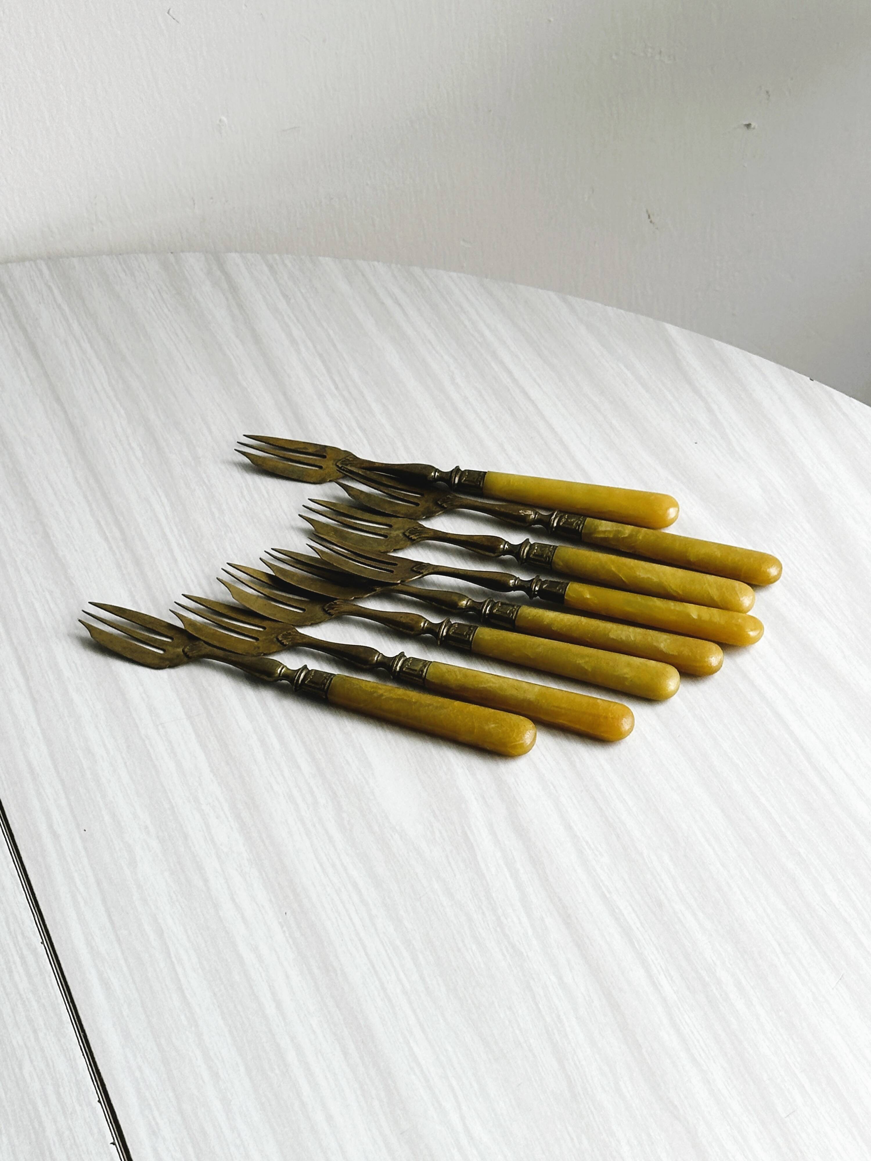 Set of 8 vintage gold metal dessert forks