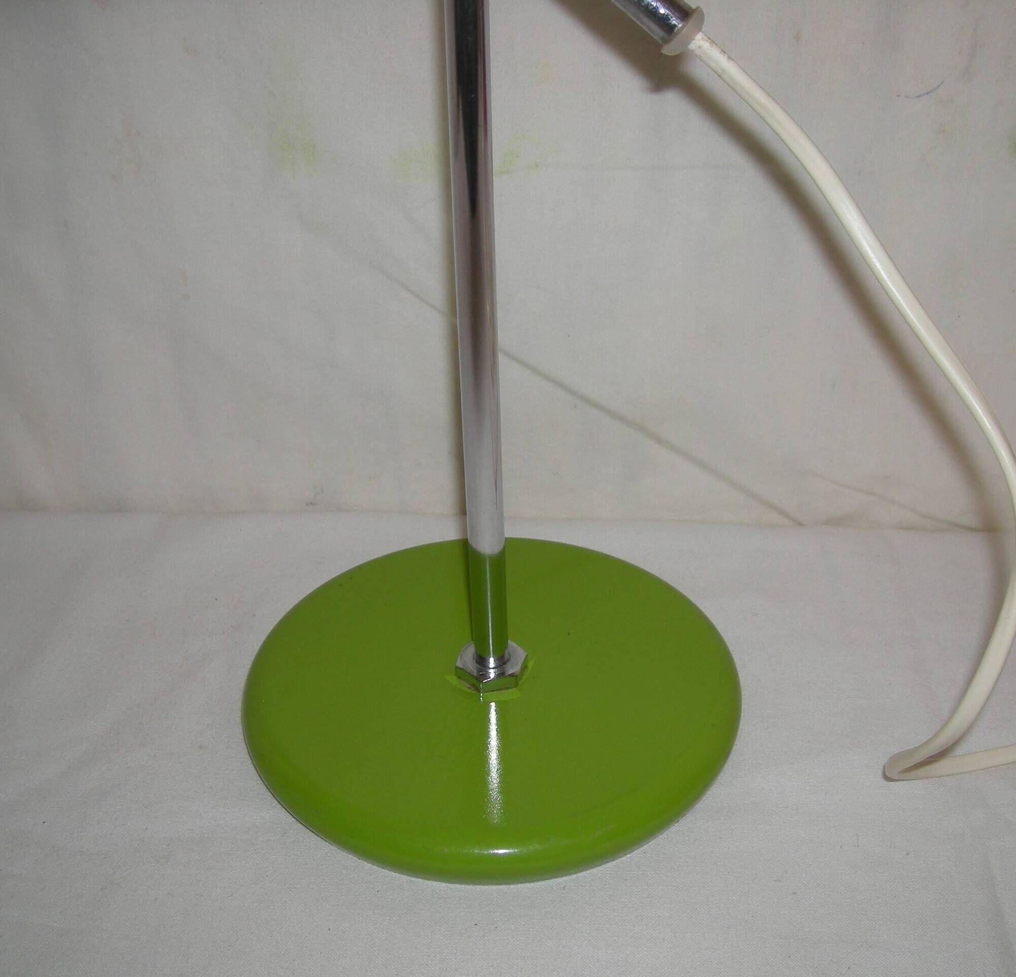 Green desk lamp with an arm from the 1970s.