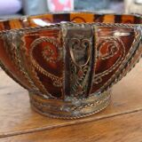 Small glass cup in metal frame