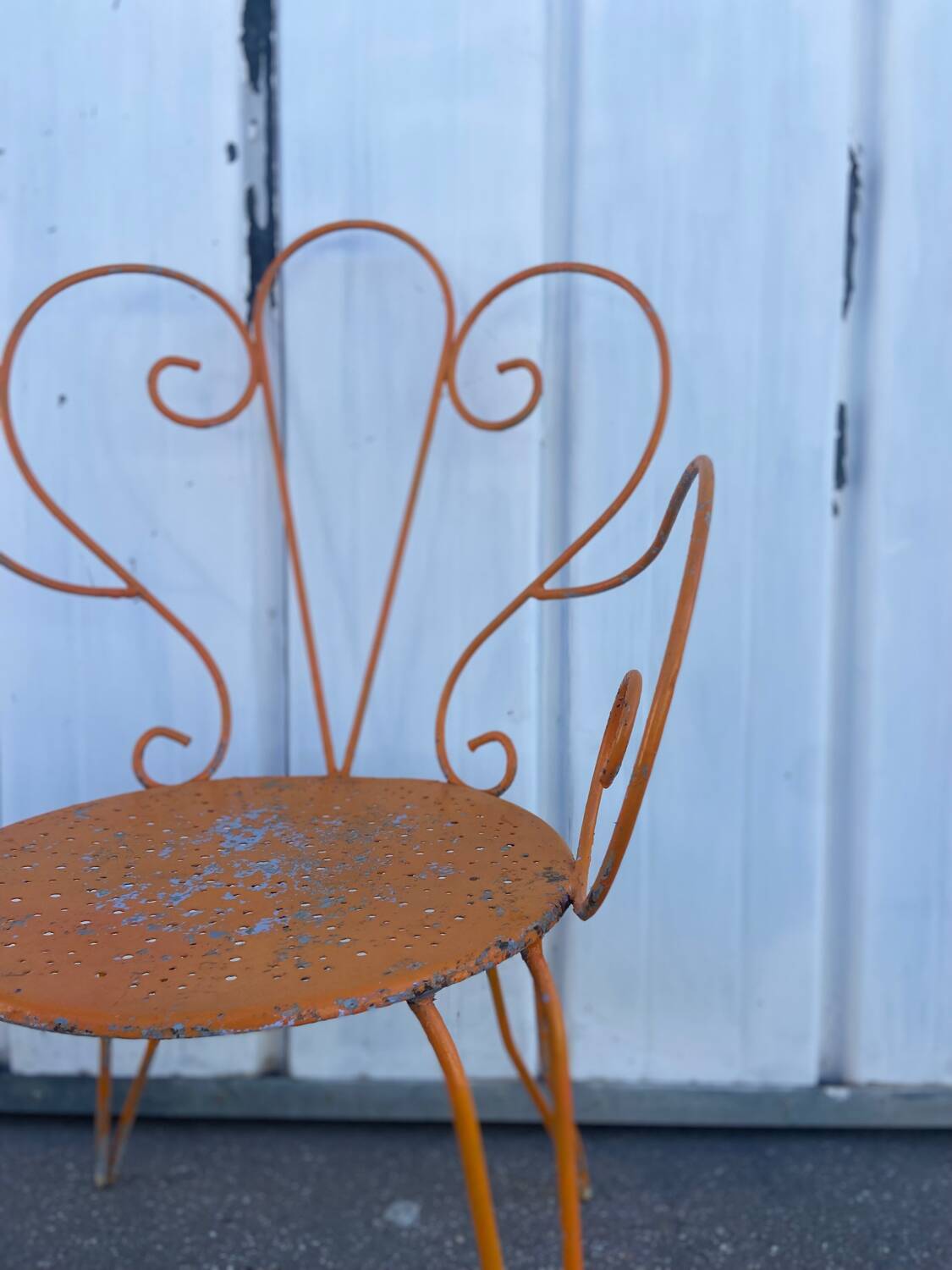 Orange wrought iron chair