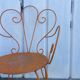 Orange wrought iron chair