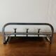 Vintage wall-mounted coat rack in chrome metal with integrated mirror and hat rack