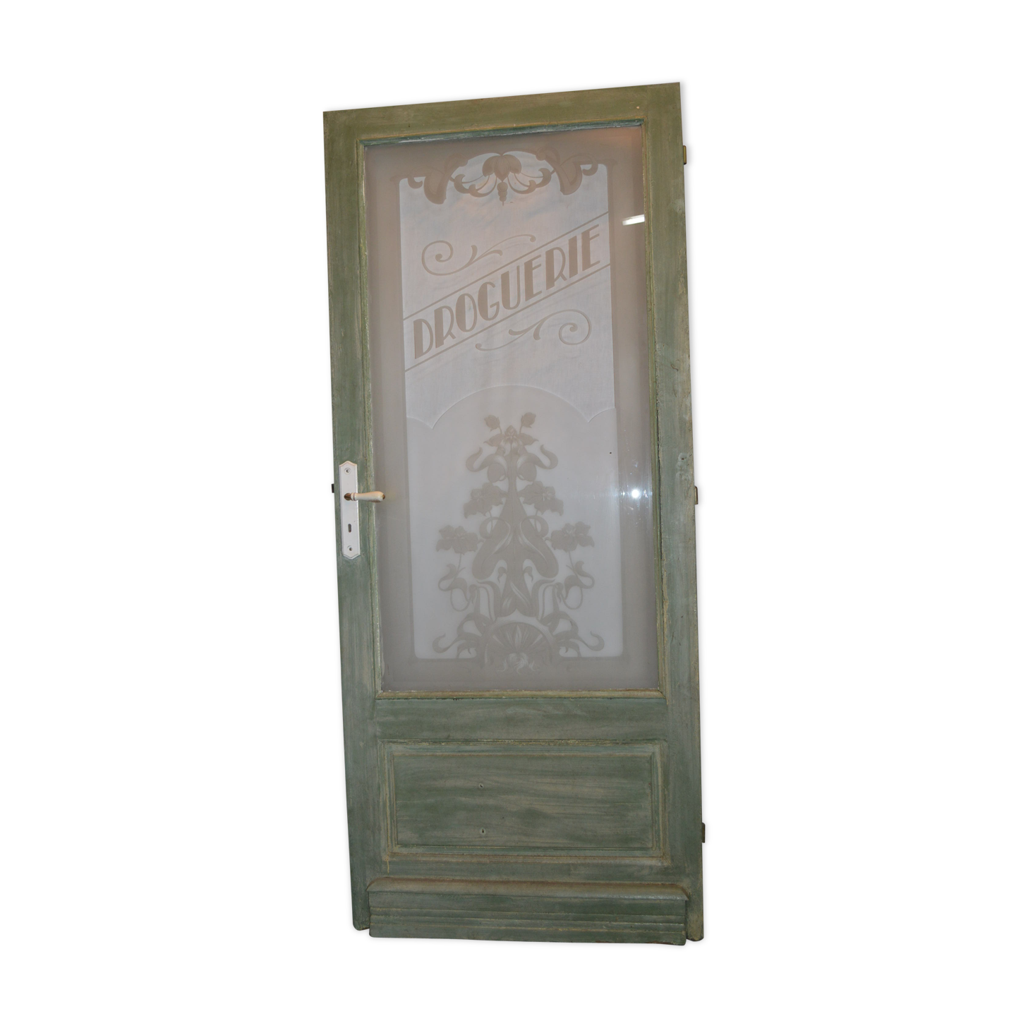Porte avec un verre gravé "droguerie"