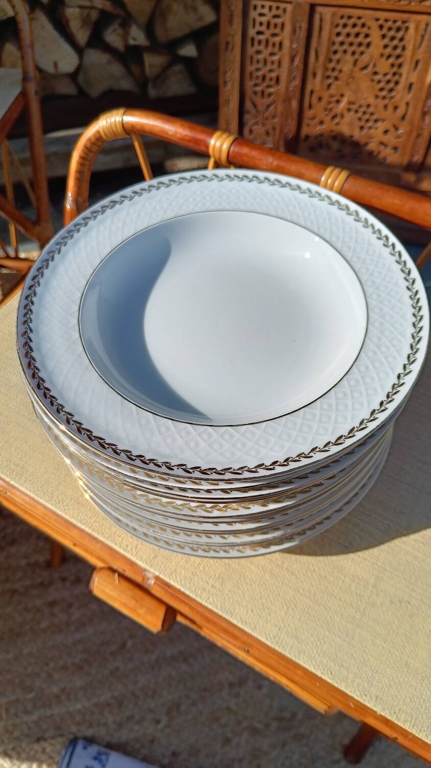Twelve white porcelain plates
