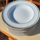 Twelve white porcelain plates