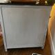 Grey-blue Parisian sideboard with a mesh door.