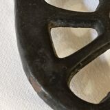 Old enameled cast iron trivet
