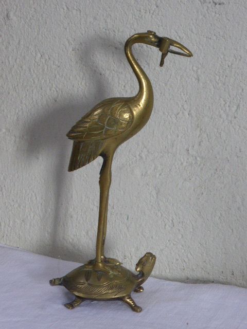 Heron in brass on the back of a turtle, press paper, vintage 1970