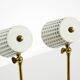 A pair of mid-century modern bedside lamps with perforated metal shades