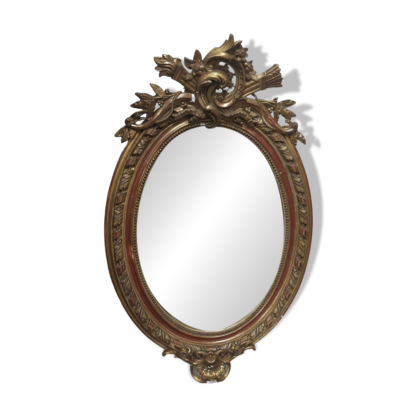 Golden oval mirror