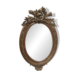 Golden oval mirror