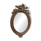 Golden oval mirror