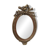Golden oval mirror