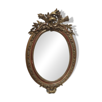 Golden oval mirror