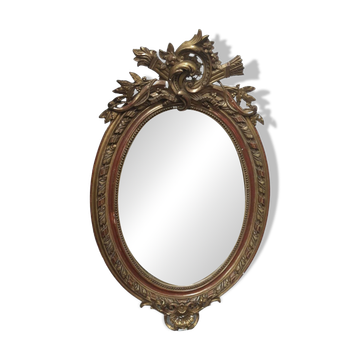 Golden oval mirror