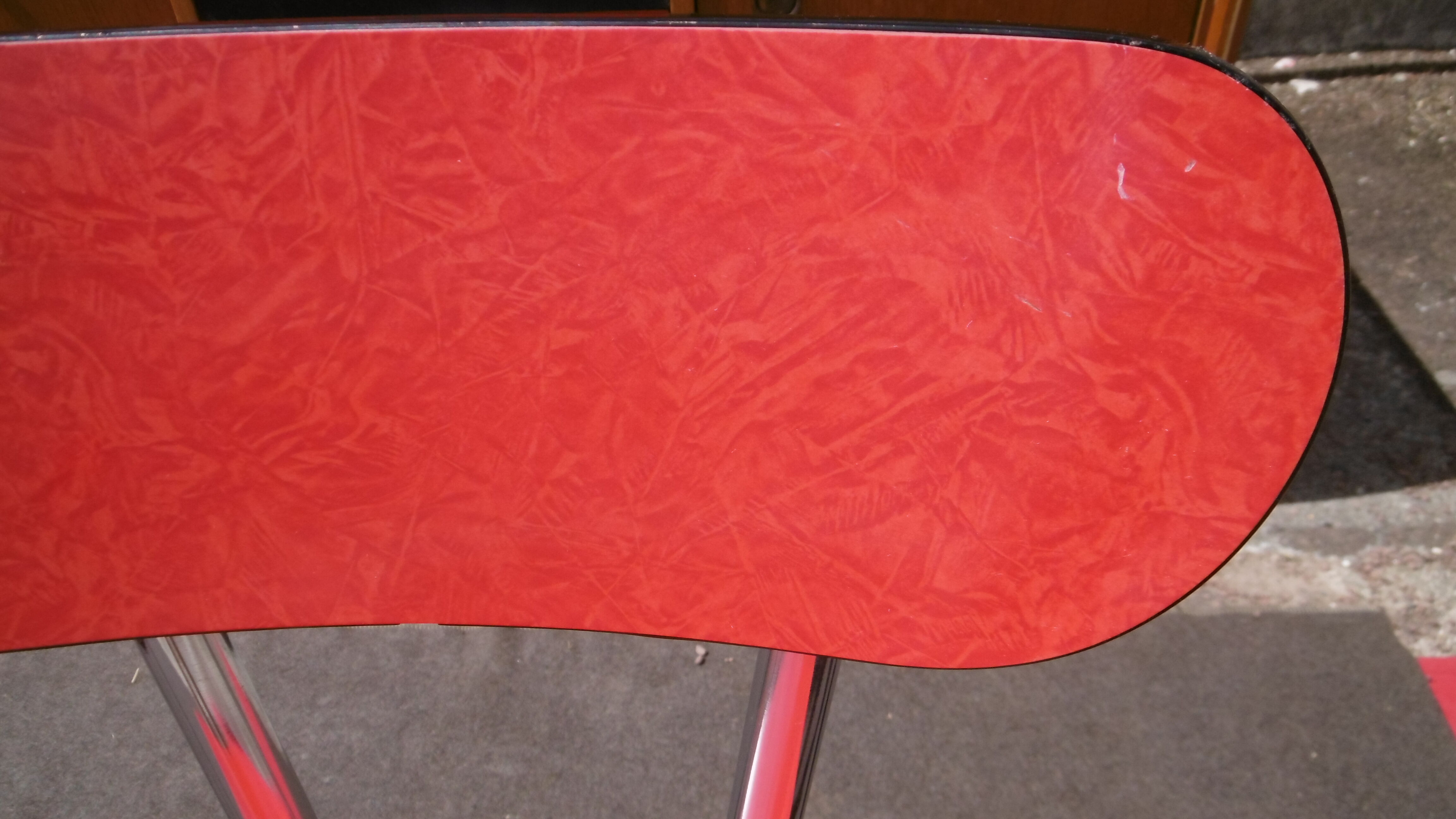 Red formica table and two chairs