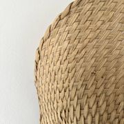 Woven rattan wall light in the style of Igno Maurer, design from the 1970s.