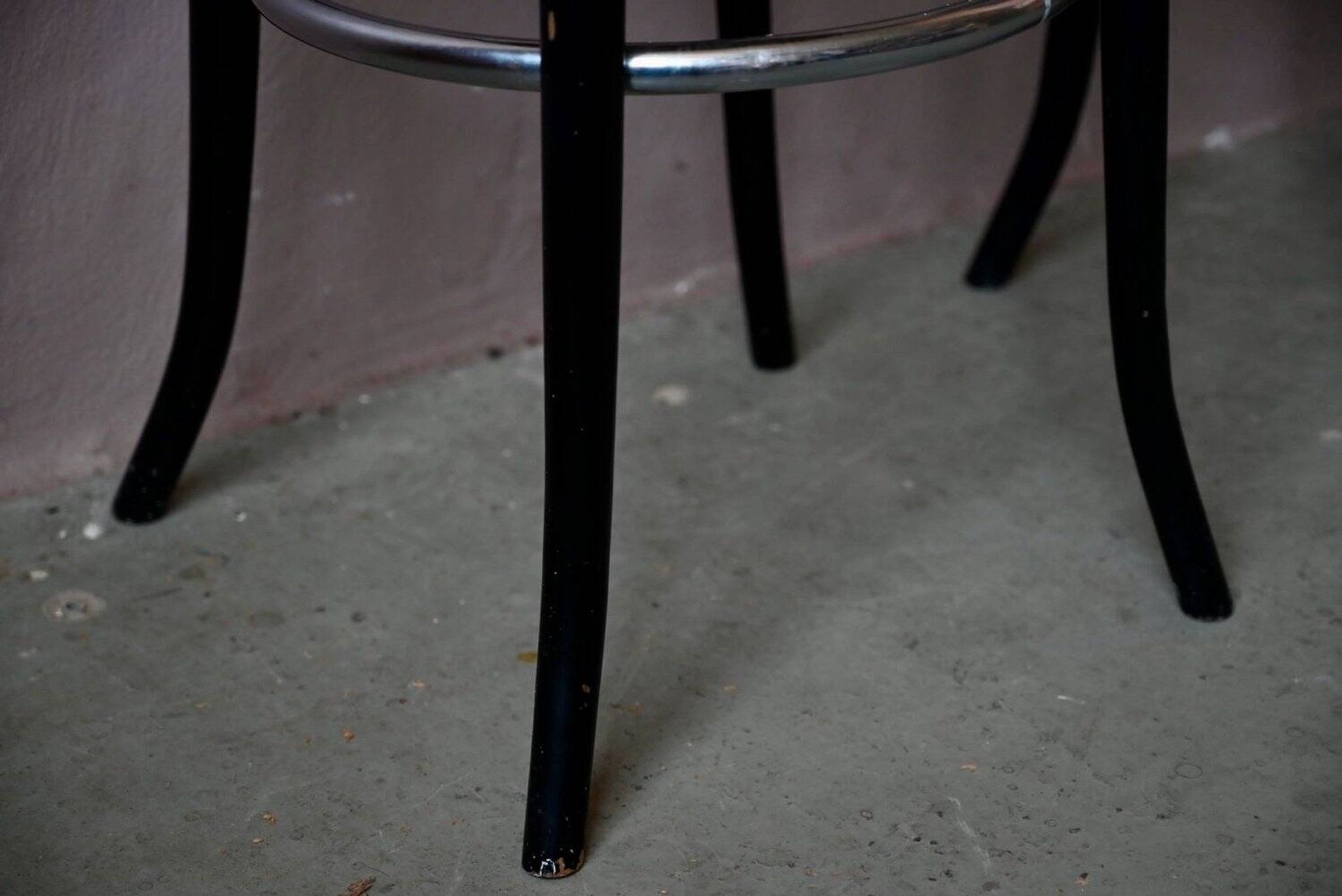 Pair of 1960s bistro bar stools in black and chrome with vinyl shell.