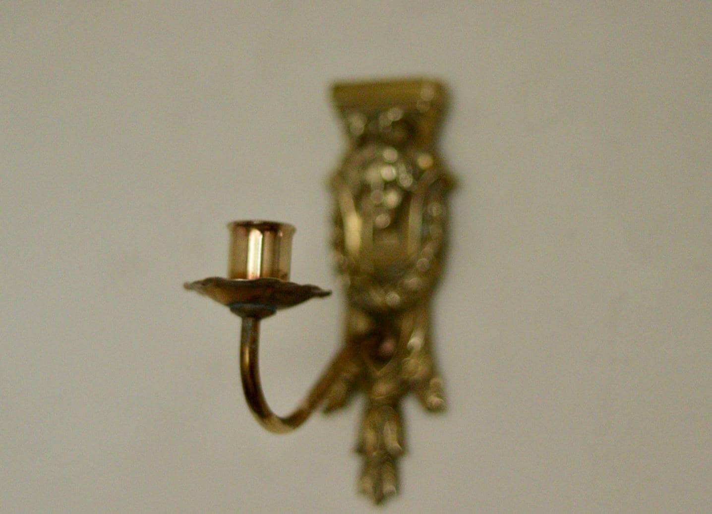 Pair of mid-century Swedish brass face motif sconces