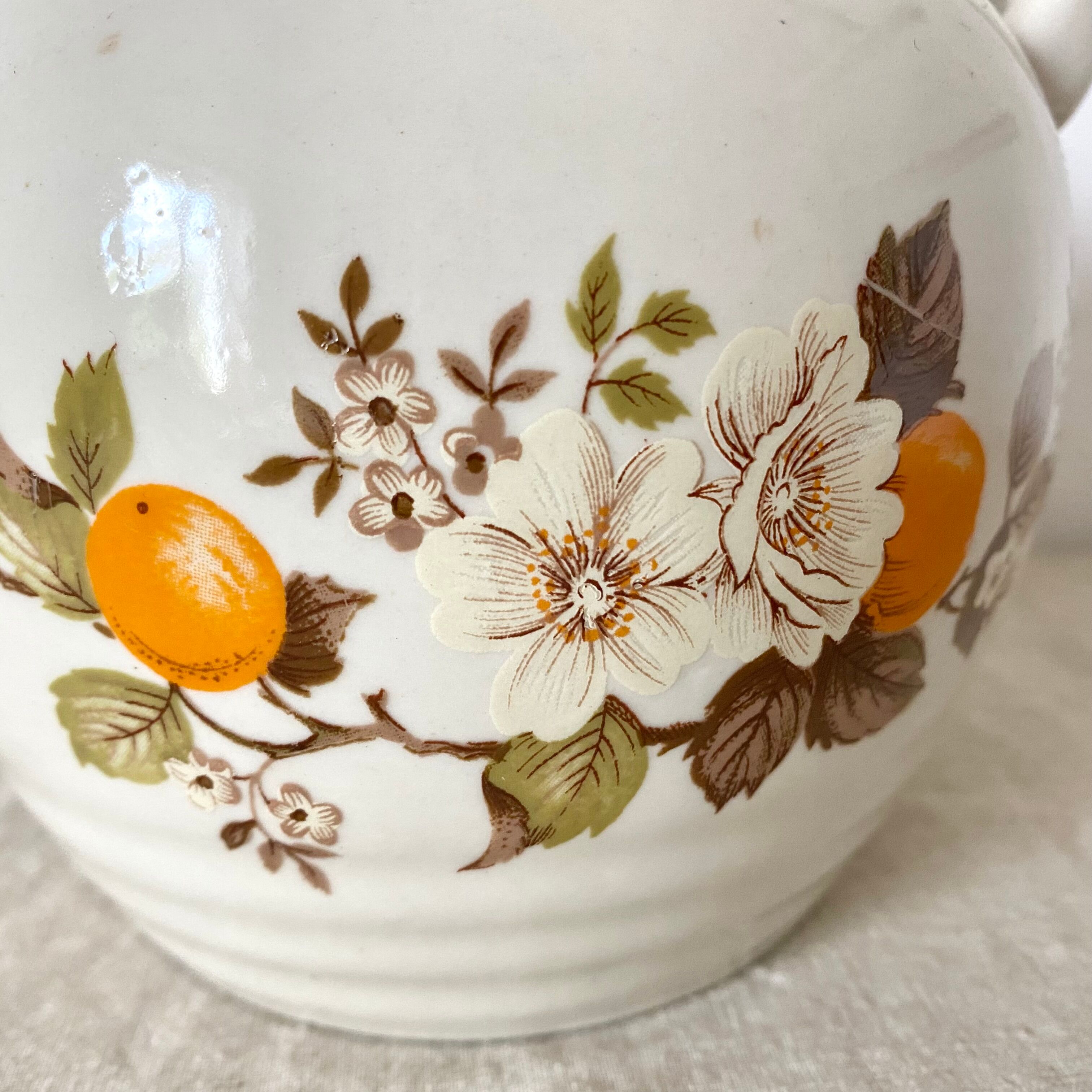 Vintage porcelain and rattan teapot