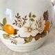 Vintage porcelain and rattan teapot
