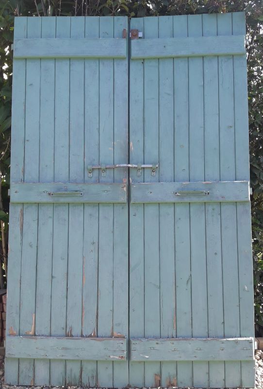 Pair of large wooden iron hanging shutters