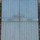 Pair of large wooden iron hanging shutters