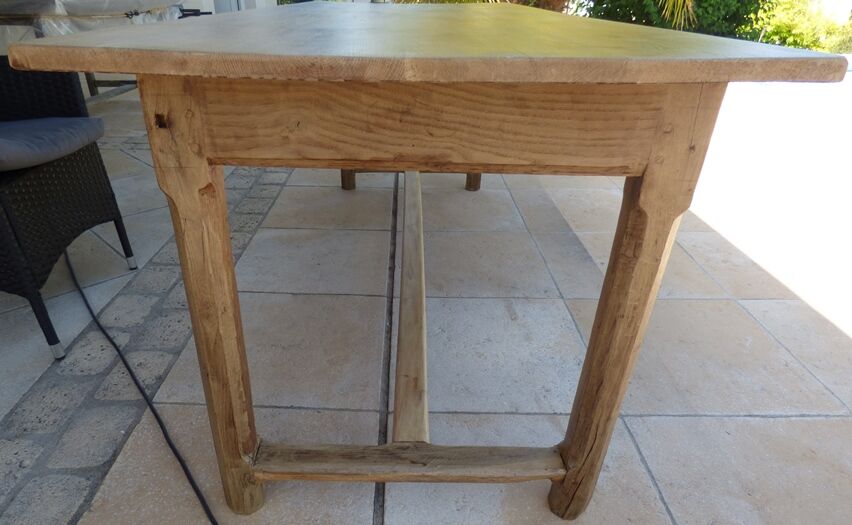 Large honey-colored farmhouse table in solid oak