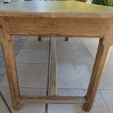 Large honey-colored farmhouse table in solid oak