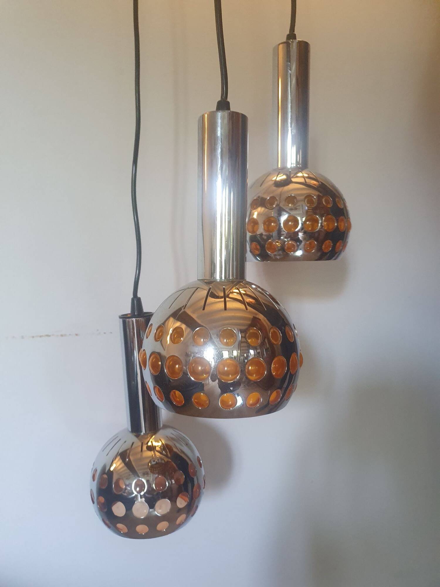Raak three-light space age orange pendant lamp, 1970s, Netherlands