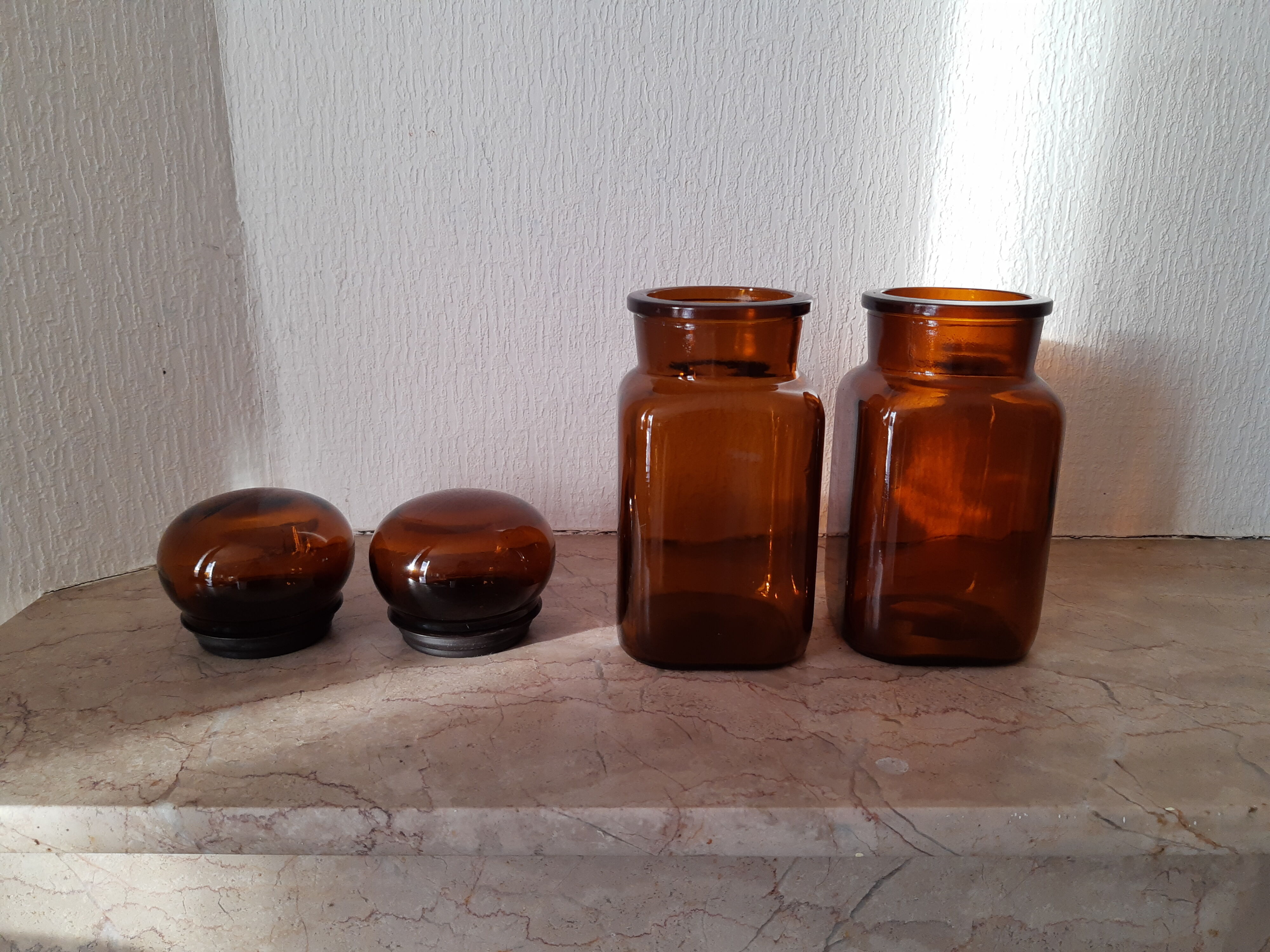 Pair of vintage amber glass jars