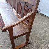 Oak church bench period XVII th century, back decorated with carved parchments