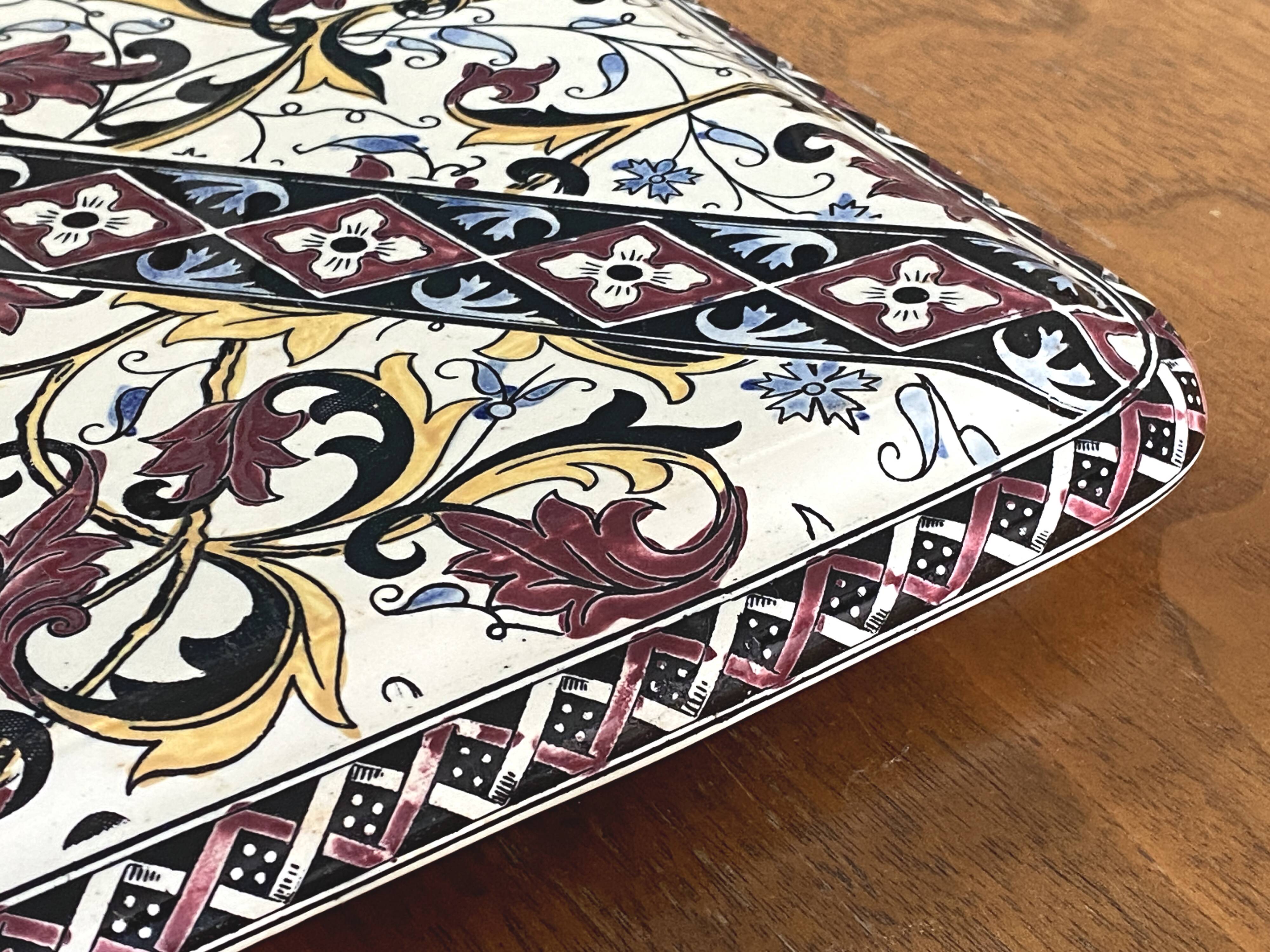Vintage trivet in Gien earthenware with cornflower decoration.