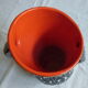 Vintage dark streaked white interior red vase