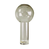 A modernist vase in clear glass.