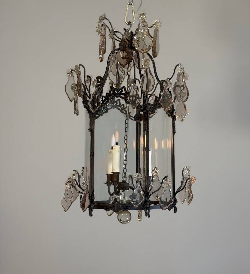 Louis XV style lantern in blackened brass adorned with cut crystal pendants, circa 1900.