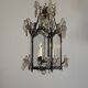 Louis XV style lantern in blackened brass adorned with cut crystal pendants, circa 1900.