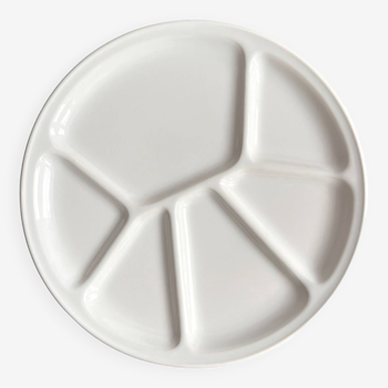 A new white divided plate for appetizers, Germany in the 1970s.