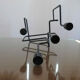Modernist candle holder in black lacquered metal 1990