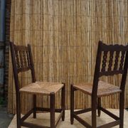 Pair of antique straw-seated farm chairs