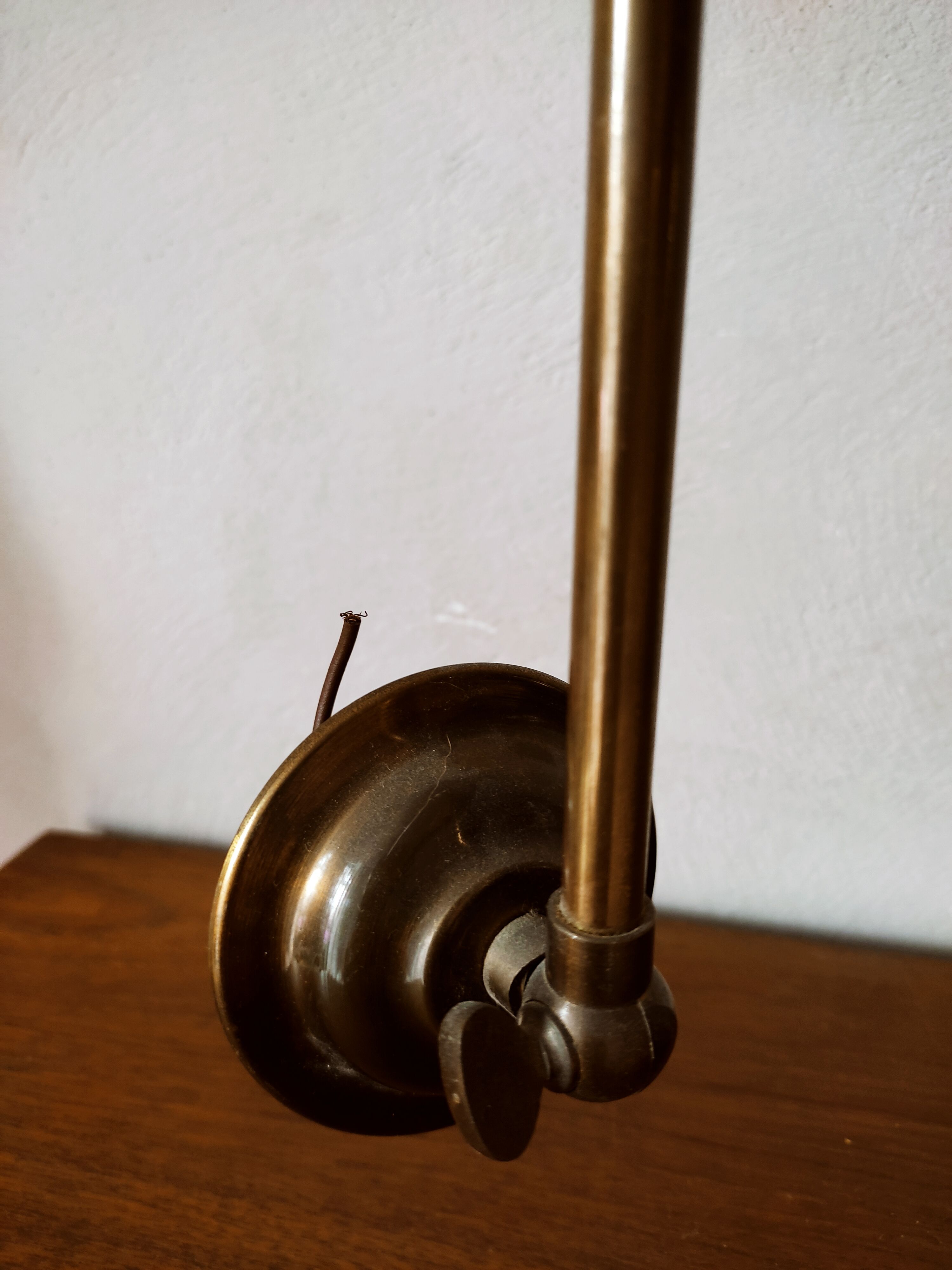 Brass wall lamp with pale pink bell