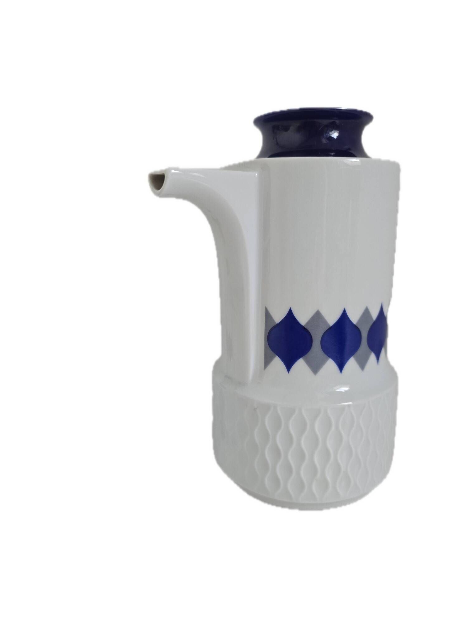 Vintage Schirnding Bavaria coffee pot and milk jug, blue geometric pattern.