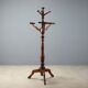 Antique coat rack in lime wood stained walnut, Italy, 19th century.