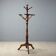 Antique coat rack in lime wood stained walnut, Italy, 19th century.